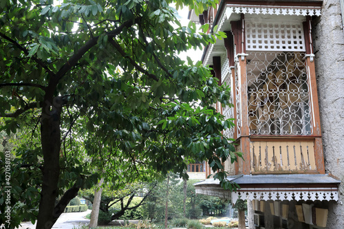 House with wooden balcony in Gurzuf park photo