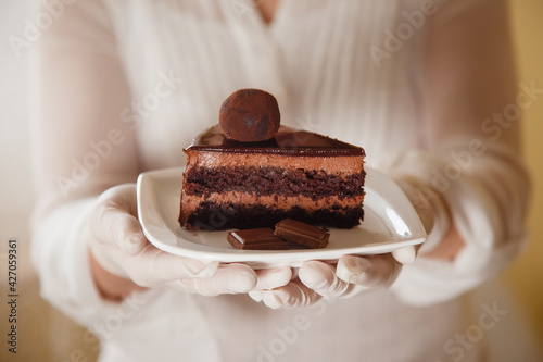 confectioner makes sweet delicious cakes at home. in bright colors