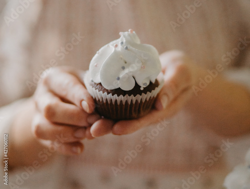 confectioner makes sweet delicious cakes at home. in bright colors