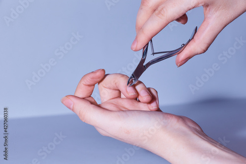 person cutting a scissors