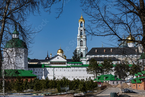 golden towers and ancient architectural solutions of the Trinity-Sergievskaya Lavra in Sergiev Posad on a sunny spring day  photo