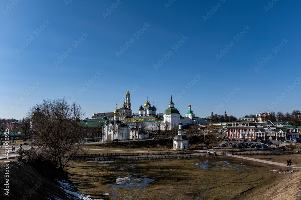 golden towers and ancient architectural solutions of the Trinity-Sergievskaya Lavra in Sergiev Posad on a sunny spring day 