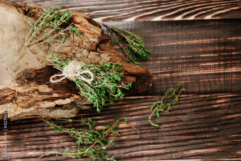 Raw green savory spices on wooden background Raw green savory spices on wooden background