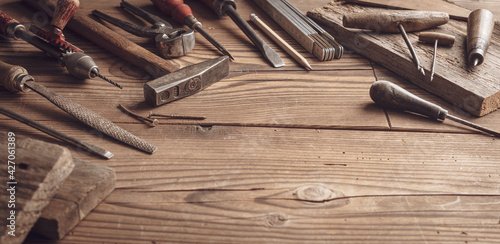 Professional vintage carpentry tools on a wooden table photo