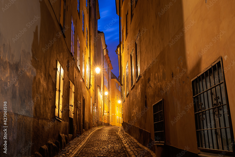 Stockholm, Sweden. Night View Of Traditional narrow Street. Residential Area, Cozy Street In Downtown. Old Town Gamla Stan. Famous Popular Destination Scenic Place. UNESCO World Heritage Site