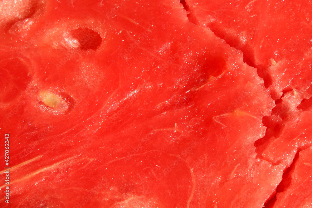 Fresh juicy piece of watermelon. Close-up. Background. Texture.