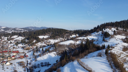 Drone shot. View of the village at the foot of the mountains. Carpathians. Ukraine.