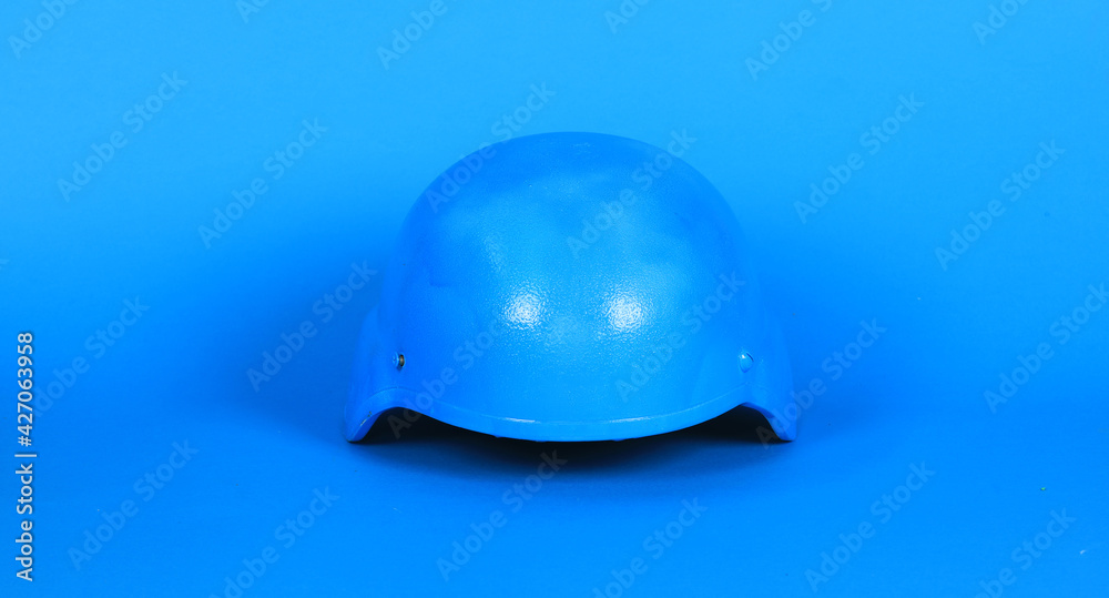 un blue helmet on blue background un blue helmet on blue background