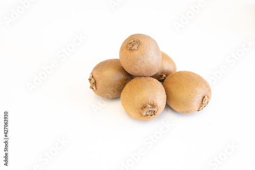 Whole fresh kiwi fruits isolated on white background with copy space for text