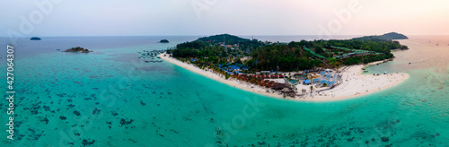 aerial bird eye panorama view of Lipe islands in evening, Satun, Thailand, peaceful landscape sea, green-blue ocean, green mountain, travel and relax place, drone high angle top view