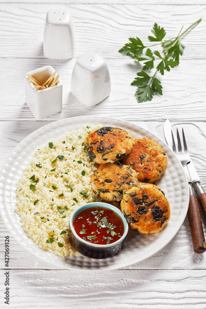 salmon and spinach fish cakes, top view salmon and spinach fish cakes, top view