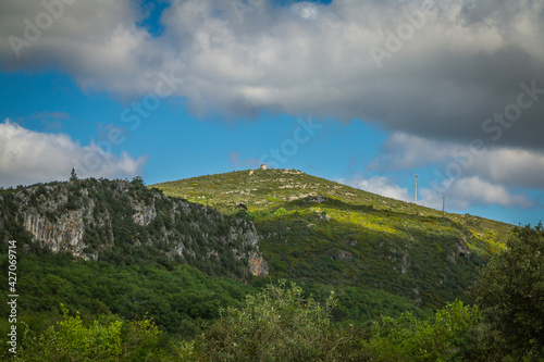 Landscape with mountains and cloudy sky in the Alvados valley - Portugal. Serra de Aire with the beautiful Alvados valley
