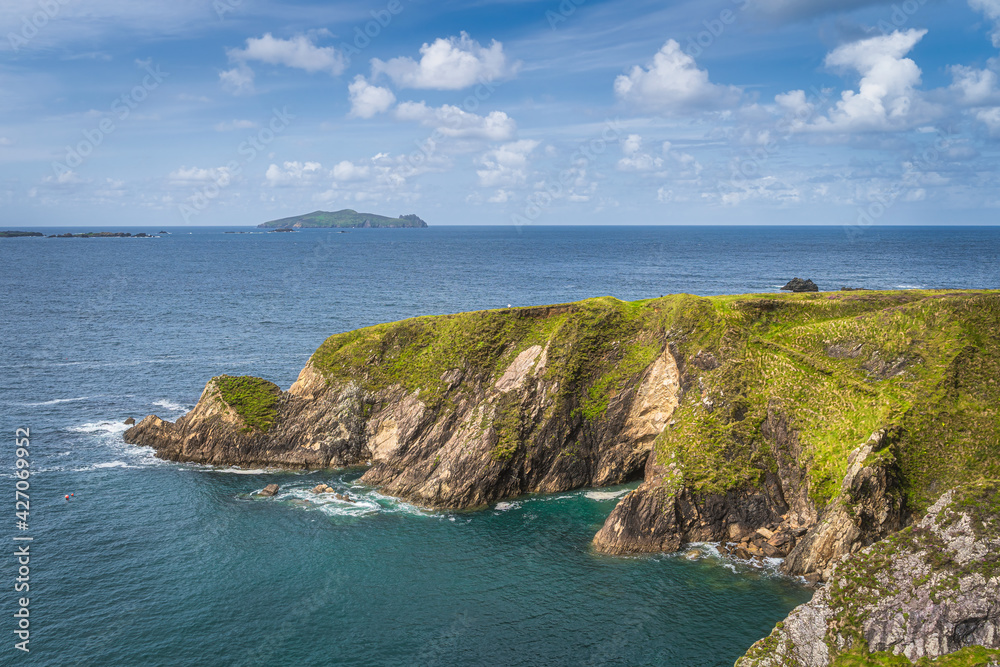 Beautiful turquoise and emerald water of Atlantic Ocean and tall cliffs near Dunquin Pier, Dingle, Wild Atlantic Way, Kerry, Ireland Beautiful turquoise and emerald water of Atlantic Ocean and tall cliffs near Dunquin Pier, Dingle, Wild Atlantic Way, Kerry, Ireland