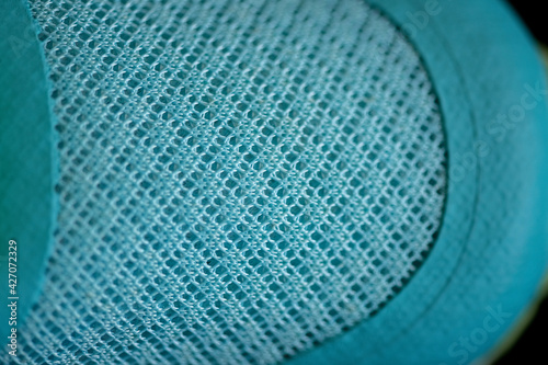Fragment of women's sports sneakers, close-up.