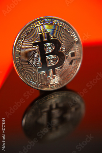 Photograph of bitcoin coins symbolizing the financial market of cryptocurrencies on a colored background and without people