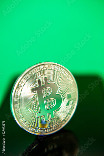 Photograph of bitcoin coins symbolizing the financial market of cryptocurrencies on a colored background and without people