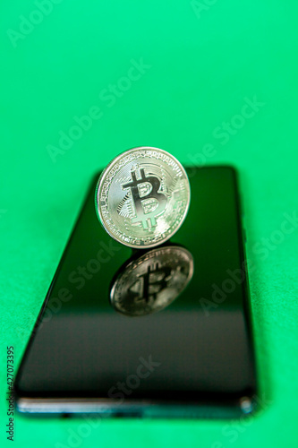 Photograph of bitcoin coins symbolizing the financial market of cryptocurrencies on a colored background and without people