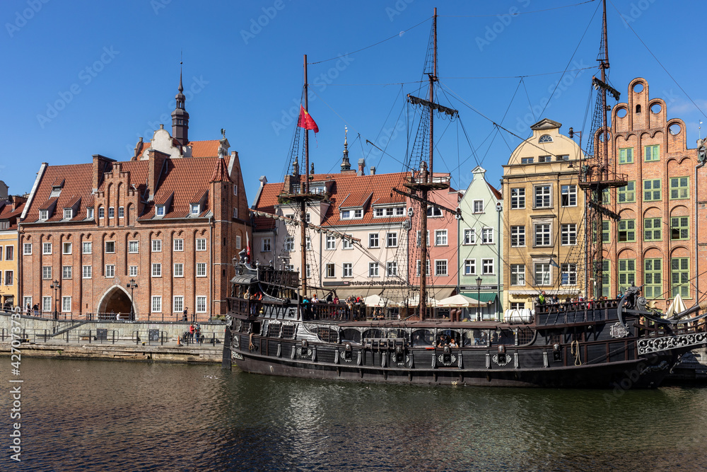 assenger harbor on the Motława River - a replica of a galleon as a cruise ship at Dlugie Pobrzeze in old town of Gdansk