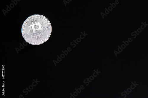 Photograph of bitcoin coins symbolizing the financial market of cryptocurrencies on a colored background and without people