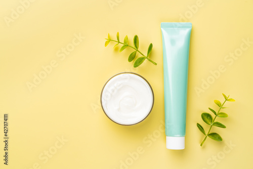 Wallpaper Mural Cosmetic cream for skin on yellow background, top view with copy space Torontodigital.ca