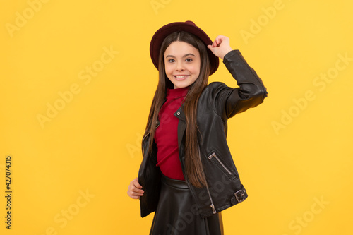 happy teen girl in hat and leather jacket, cool © Olena