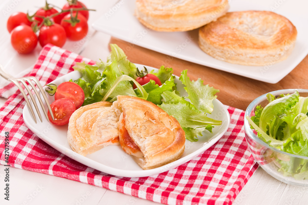 Puff pastry filled with tomato and mozzarella cheese. Puff pastry filled with tomato and mozzarella cheese.