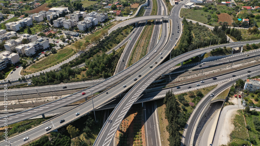 Aerial drone photo of multilevel highway intersection junction toll road outside city urban center Aerial drone photo of multilevel highway intersection junction toll road outside city urban center