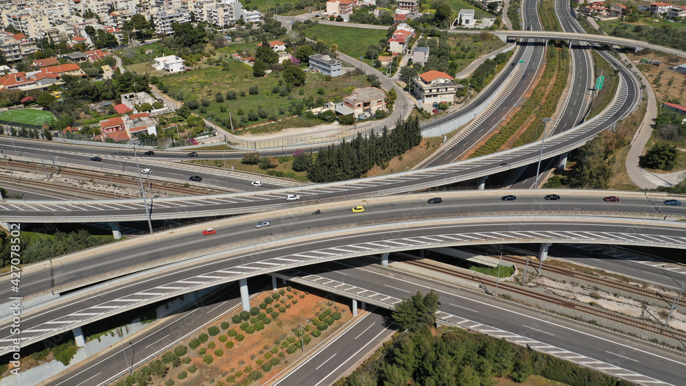 Aerial drone photo of multilevel highway junction toll road of Attiki Odos connecting Attica to Athens International Airport of Eleftherios Venizelos, Attica, Greece Aerial drone photo of multilevel highway junction toll road of Attiki Odos connecting Attica to Athens International Airport of Eleftherios Venizelos, Attica, Greece
