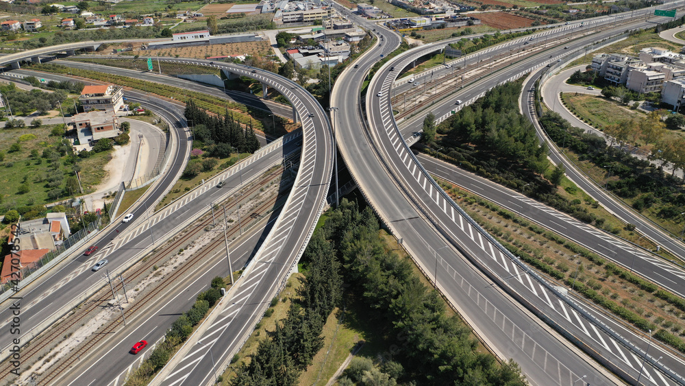 Aerial drone photo of multilevel highway intersection junction toll road outside city urban center