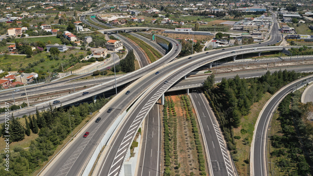 Aerial drone photo of multilevel highway intersection junction toll road outside city urban center Aerial drone photo of multilevel highway intersection junction toll road outside city urban center
