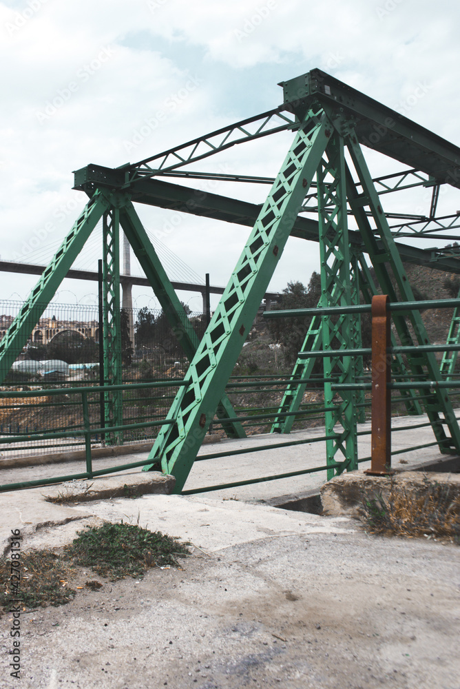The historic steel truss swing bridge over the Rhumel's River in Constantine ,Algeria . steel truss bridge. The historic steel truss swing bridge over the Rhumel's River in Constantine ,Algeria . steel truss bridge.