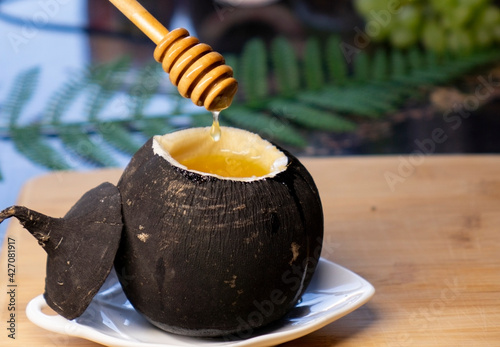 Black radish with honey.Natural honey cough syrup . photo