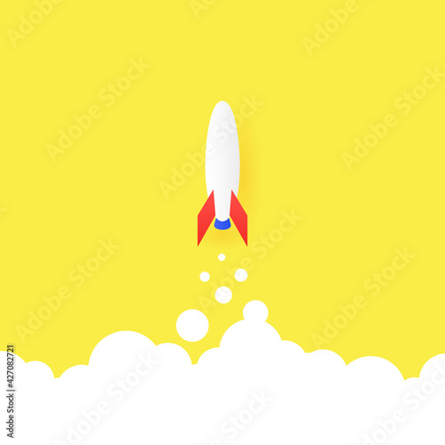 The concept of a successful start. Startup launch, big idea and creativity. A rocket on a yellow background takes off above the clouds.