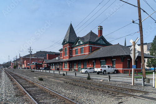 Port Jervis, NY - USA - April 10,2021: a landscape view of the historic Port Jervis station. Built in 1892 as a passenger station for the Erie Railroad by Grattan and Jennings in the Queen Anne style. photo