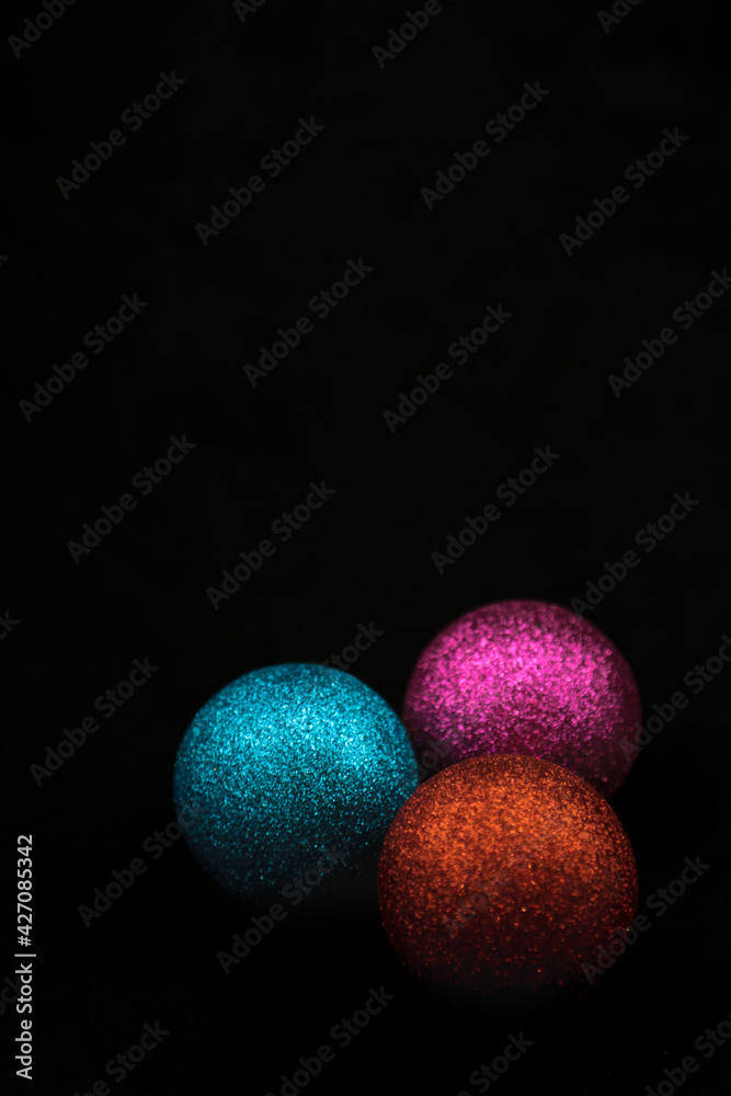 Christmas tree decorations on black background Christmas tree decorations on black background