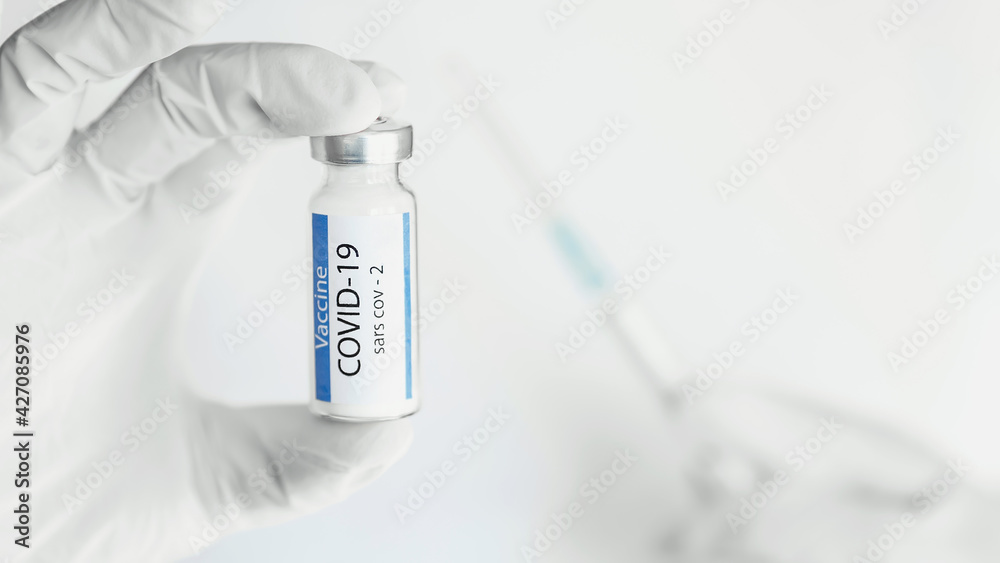 COVID-19 vaccine in hand close up. Hand in gloves holding covid-19 vaccine disease preparing. COVID-19 vaccine in hand close up. Hand in gloves holding covid-19 vaccine disease preparing.