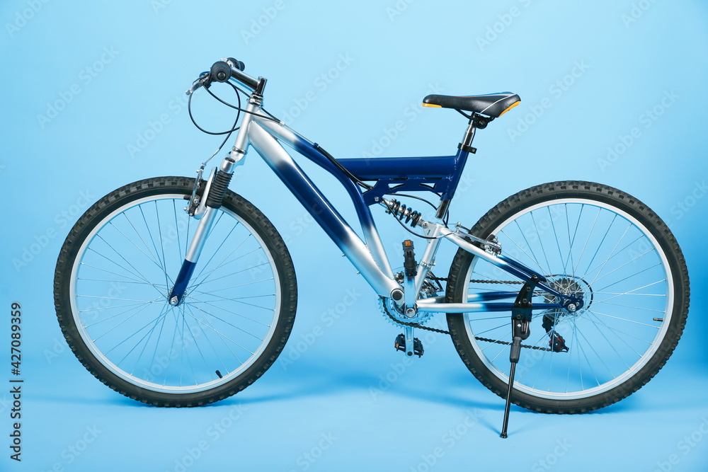 studio shot of a mountain bicycle on blue background