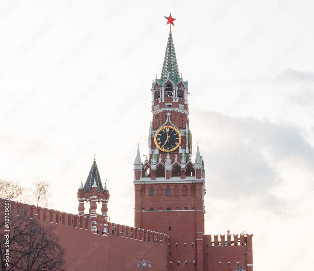 Moscow, Russia. View ot the Moscow Kremlin wall and Spasskaya tower. Sunset with clouds Moscow, Russia. View ot the Moscow Kremlin wall and Spasskaya tower. Sunset with clouds
