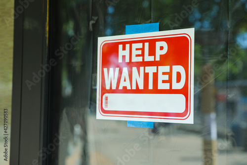 Help wanted sign in front of store