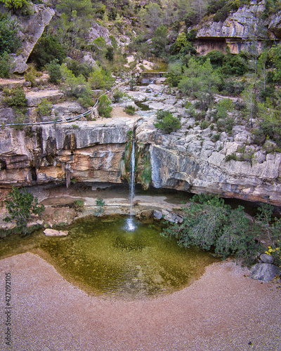 drone view of the natural pools and waterfall in the rocks of the Charcos de Quesa, located in Valencia, Spain. photo