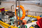 Close up of the life saving ring on a crab fishing boat on Cromer beach on the North Norfolk coast. Selective focus, shallow depth of field and bokeh