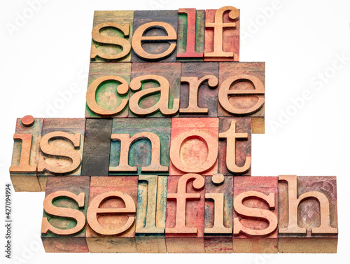 Fotografía self care is not selfish  - isolated word abstract in vintage letterpress wood t