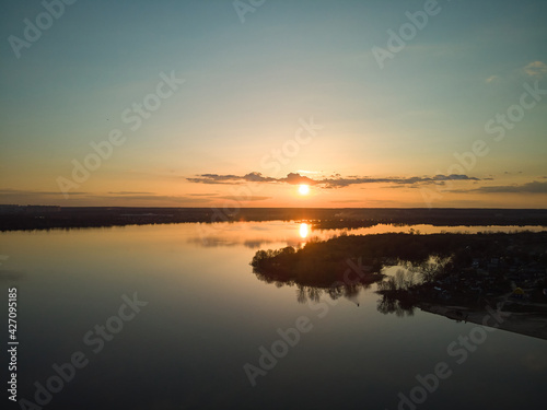 drone aerial photo of flight above the river at sunset time. © Andrey Cherlat