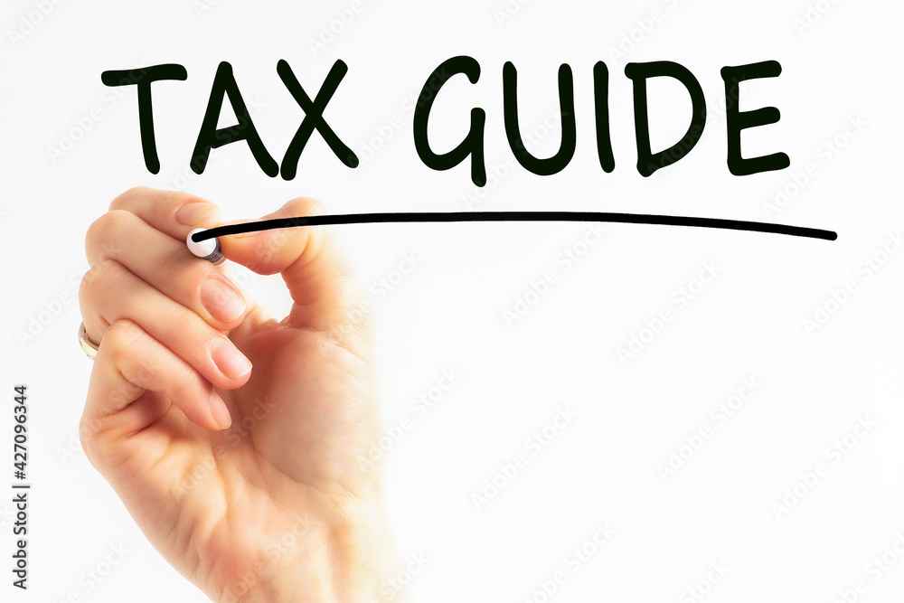 hand writing inscription tax guide with marker, concept, stock image hand writing inscription tax guide with marker, concept, stock image