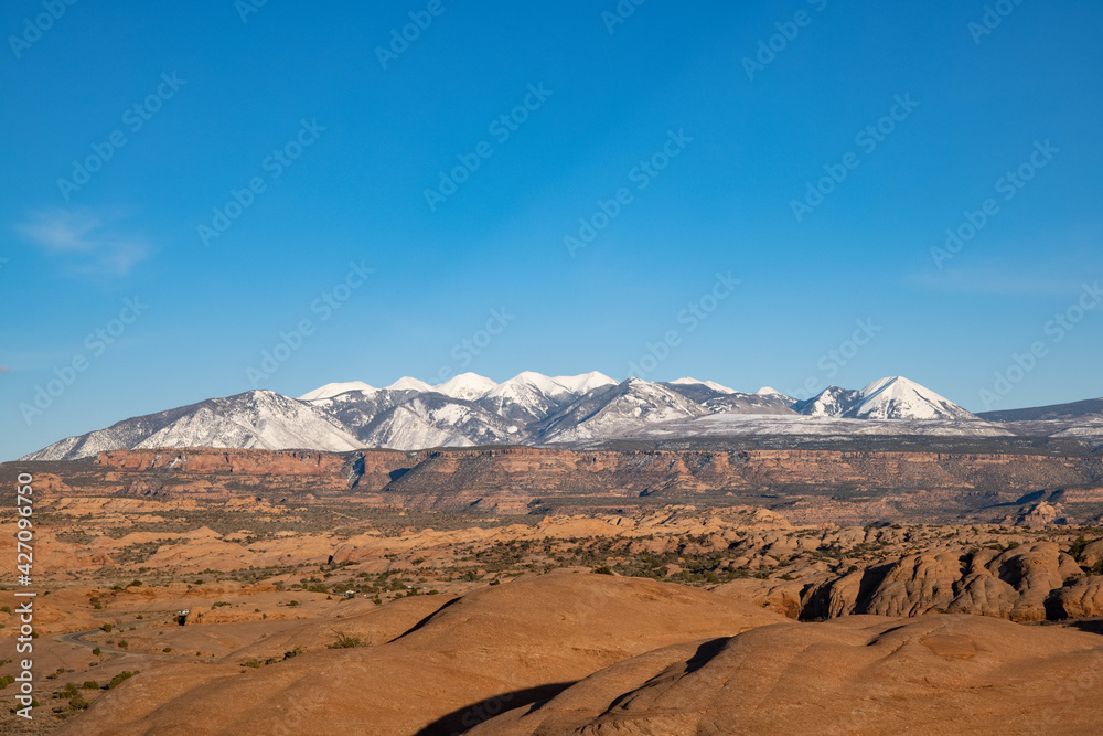 Distant mountains over rocky landscape.
