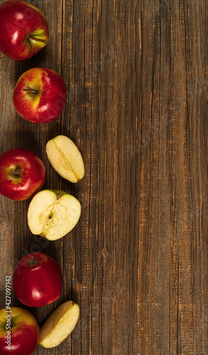 Fresh red apples  on the wooden table.Top view with copy space.Rustic food background.