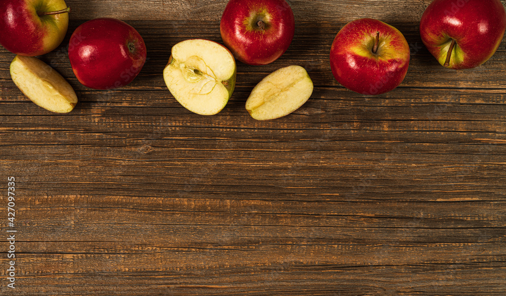 Fresh red apples on the wooden table.Top view with copy space.Rustic food background. Fresh red apples on the wooden table.Top view with copy space.Rustic food background.
