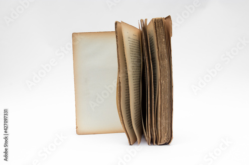 Antique open book isolated with flipping pages on white background