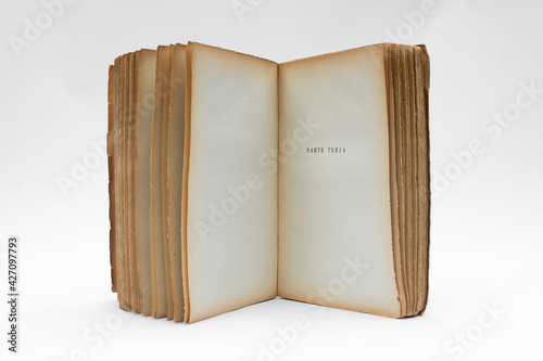 Antique open book isolated with flipping pages on white background