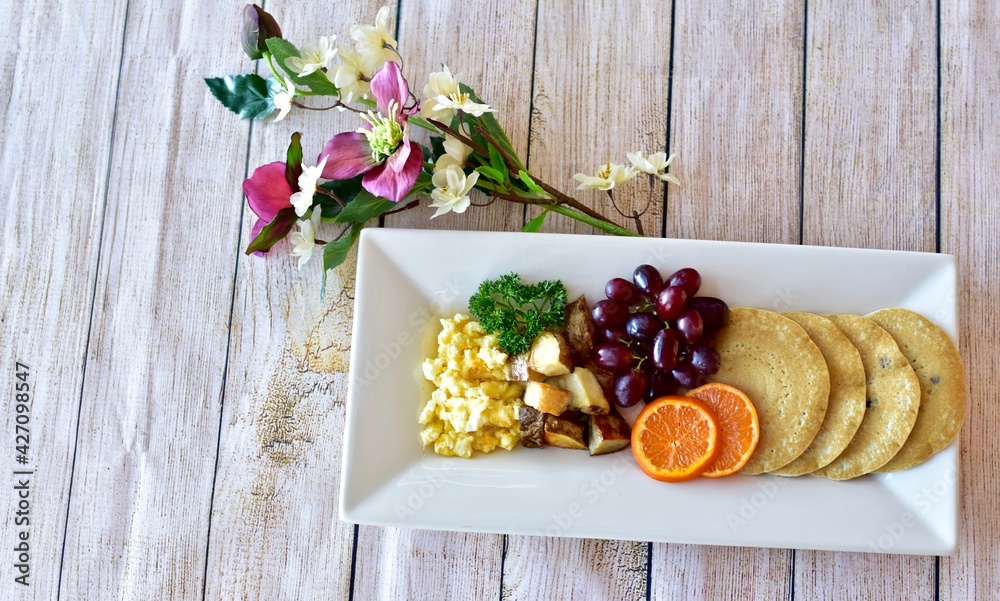 Traditional American breakfast brunch for celebration Mother's Day treat, holiday weekend food. Photo concept, food background, copy space, close-up